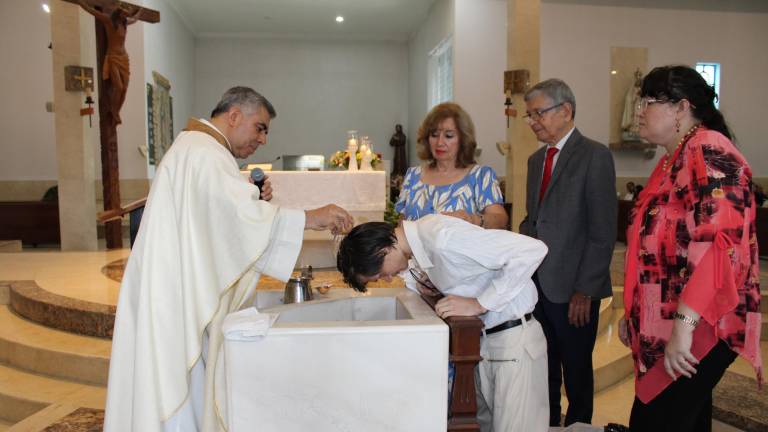 Ya son fieles católicos Eugenio y Vladimir Kolesnikov